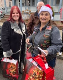 women with holiday gift bags