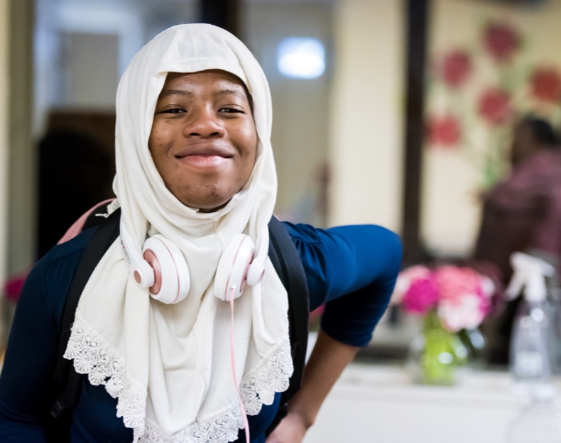 girl with headphones smiling